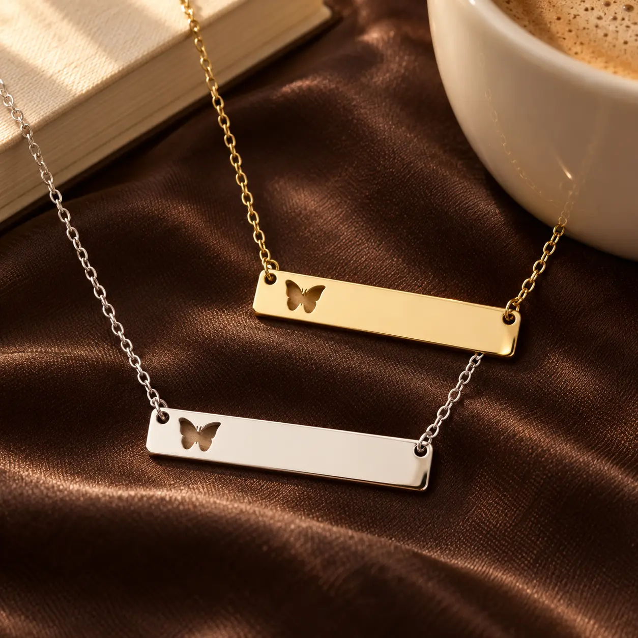 Gold and silver Butterfly Bar Necklaces with fixed butterfly cutouts displayed together