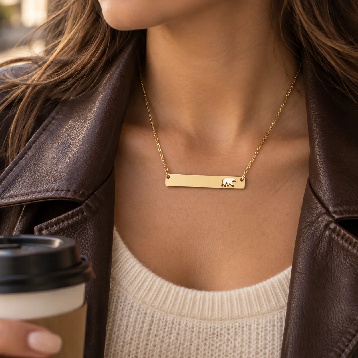 Gold Bear Bar Necklace with a fixed bear cutout worn at the collarbone