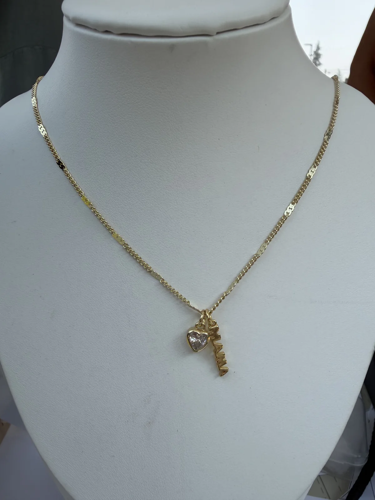 Delicate gold necklace with a keepsake key pendant