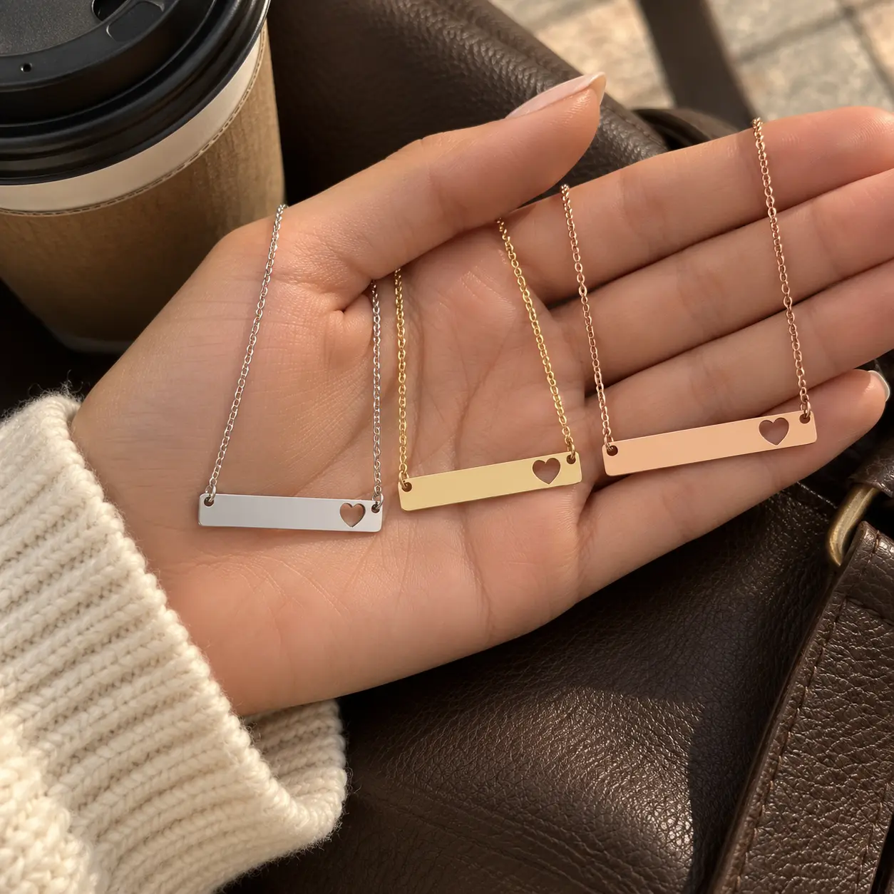 Silver, gold, and rose-gold Heart Bar Necklaces with fixed heart cutouts displayed together