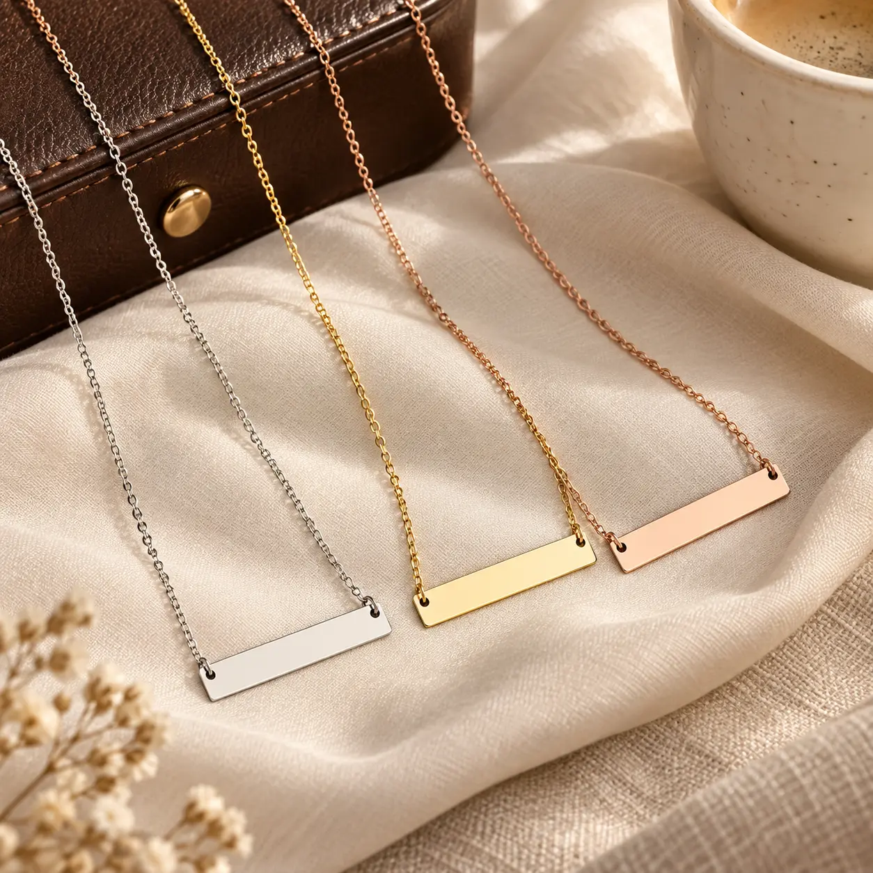 Silver, gold, and rose-gold Classic Engravable Bar Necklaces displayed together